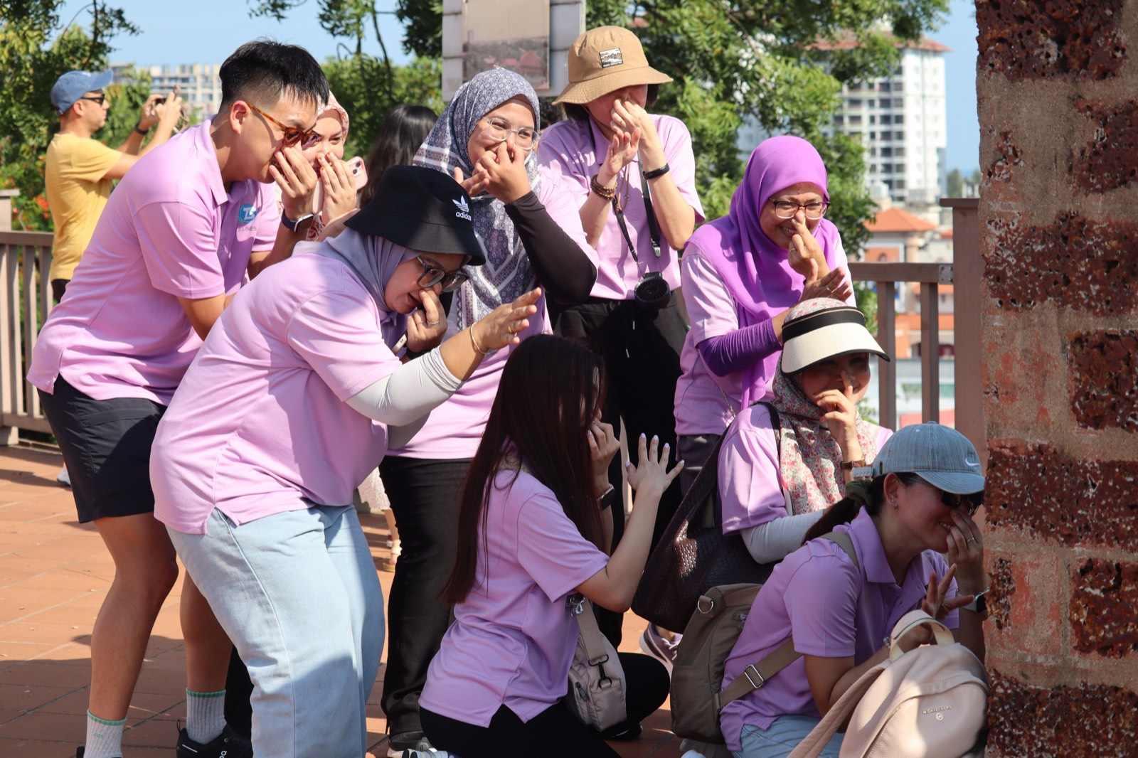 Participants laughing together during a city-hunt activity at a historic site